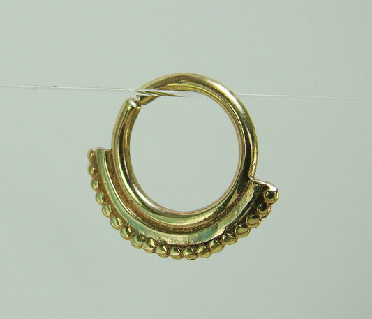 Gold Tribal piercing