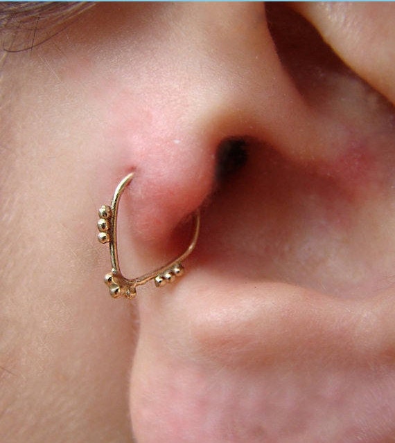 Gold tragus earring