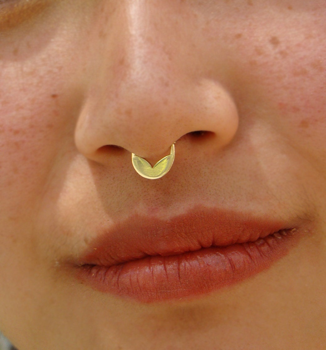 Gold tribal piercing