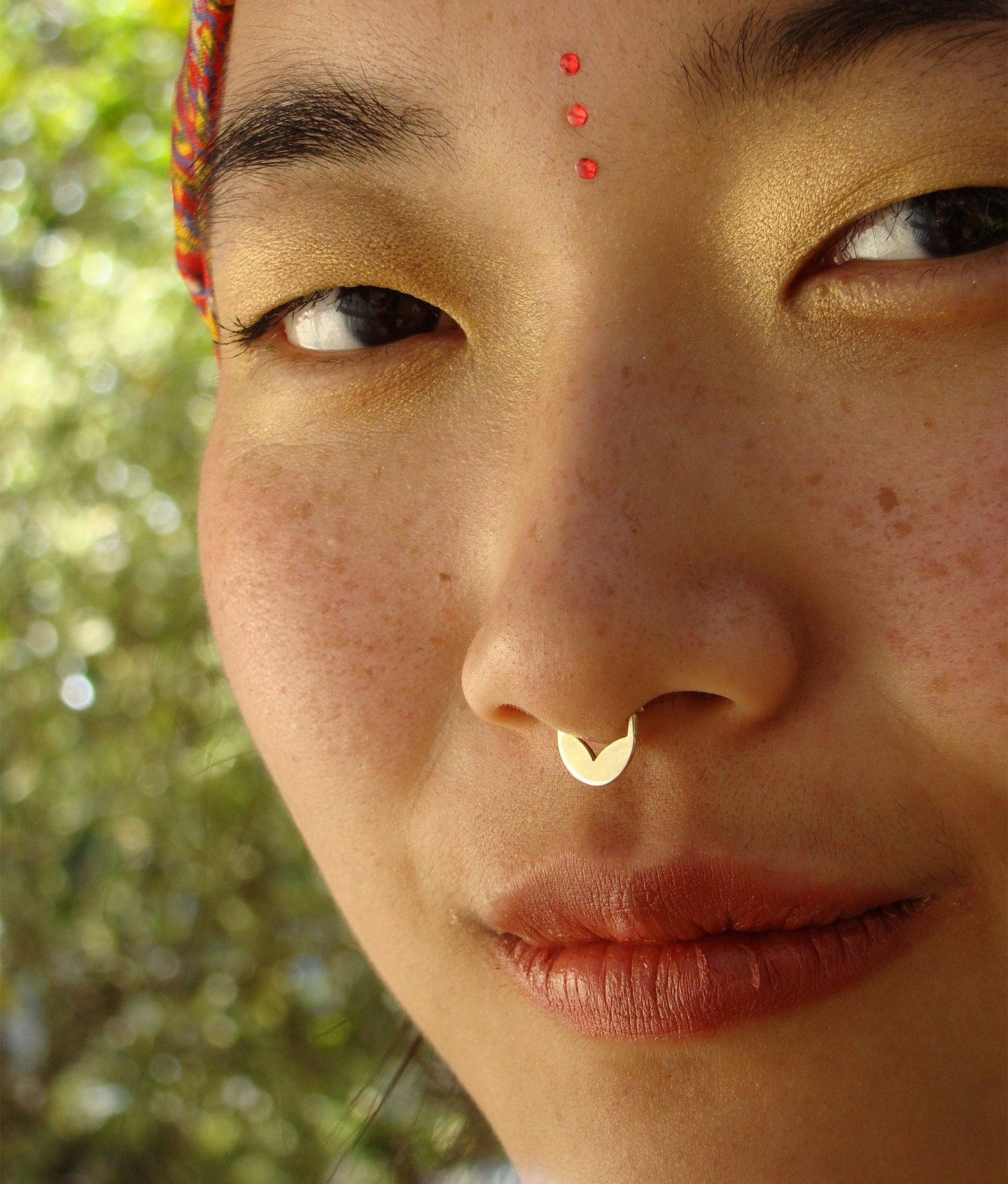 Gold tribal piercing