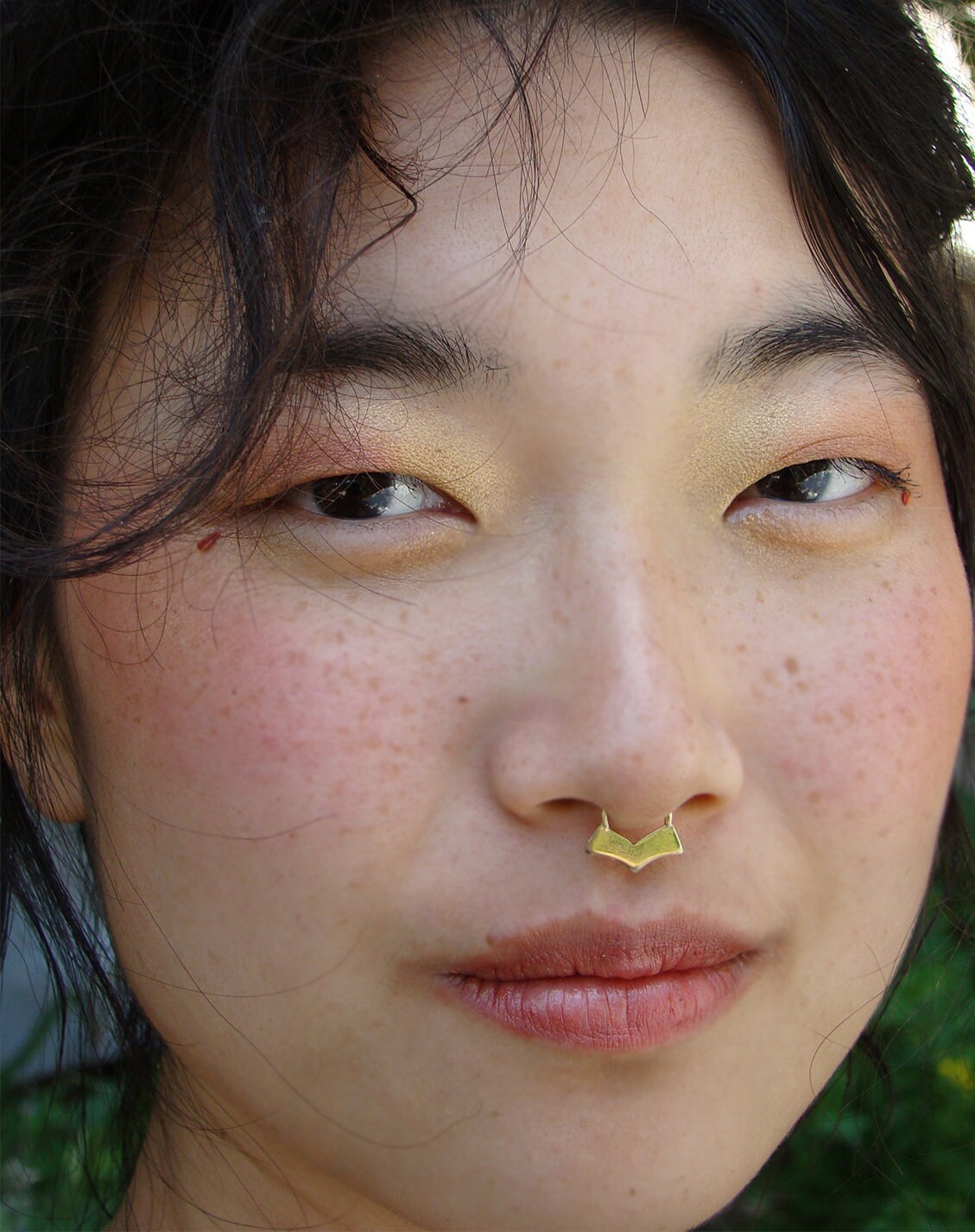 Gold tribal septum piercing