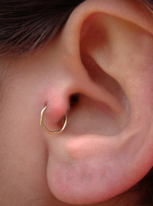 Gold tragus earring